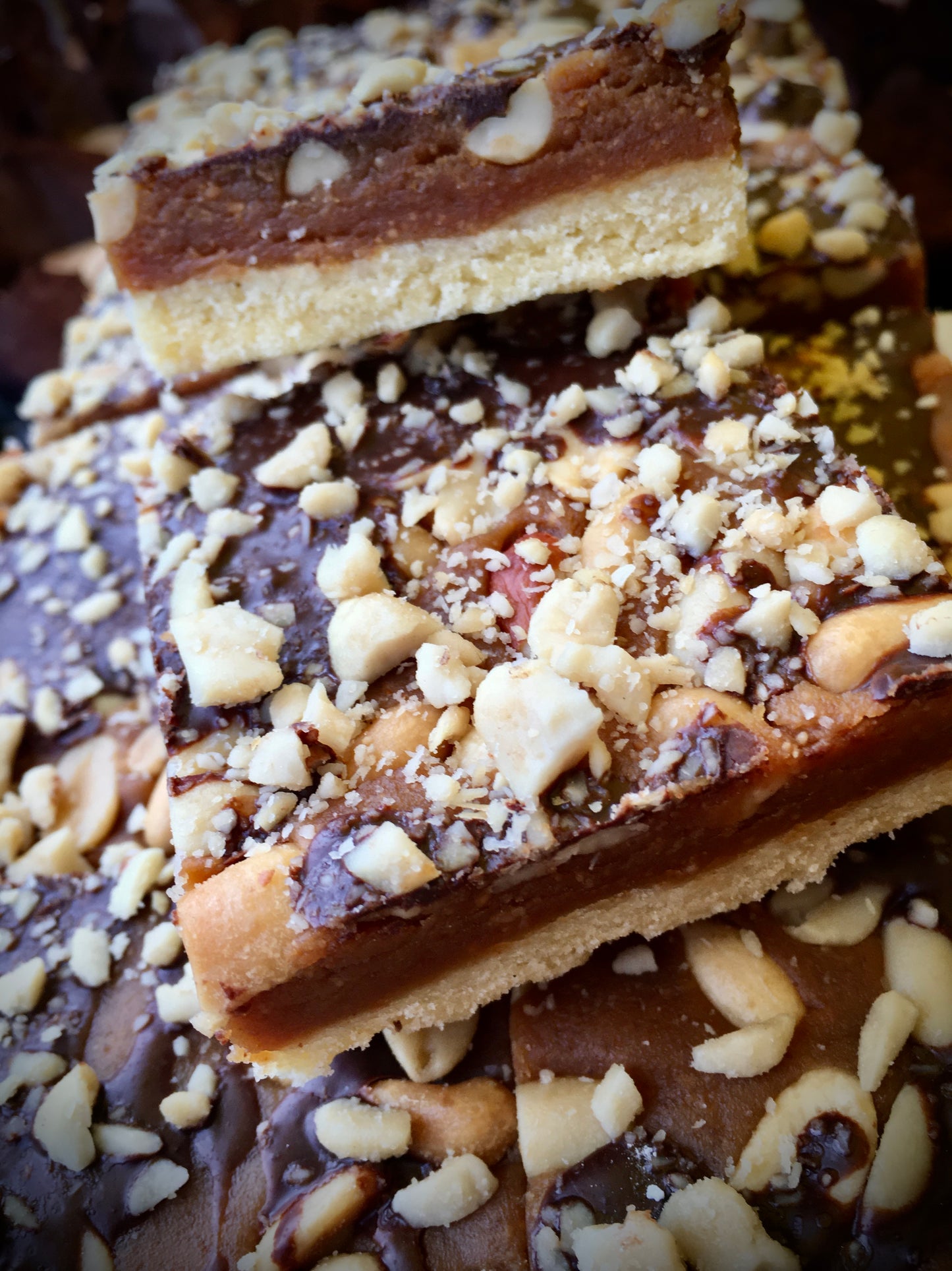 A close-up of vegan peanut butter fudge, showing its smooth, creamy texture and rich brown color.